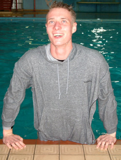 pool lifeguard swimming in uniform clothes